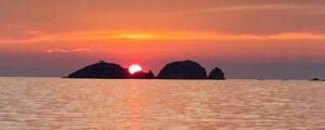 Aliki Sunset with traditional boat